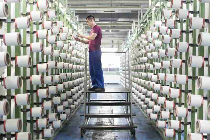 Man working at Aquafil with ECONYL® yarns